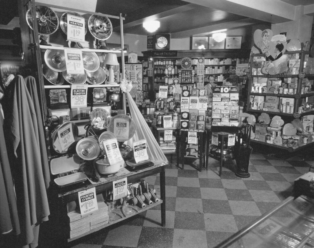 a well-stocked retail hardware and appliance store interior, showcasing shelved merchandise and product displays, reflecting the long history of retail environments where customer experience and service have always driven sales.